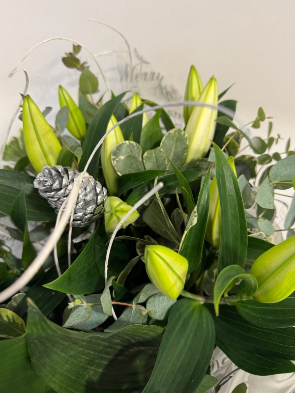 Maria’s Christmas white mini  lily handtied bouquet delivered in water  and boxed