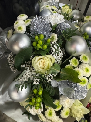 Maria’s Christmas handtied bouquet in whites and silver delivered in water and boxed