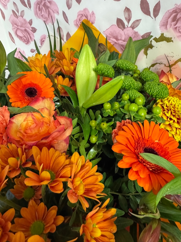 Nikos choice handtied bouquet gift wrapped into box with water