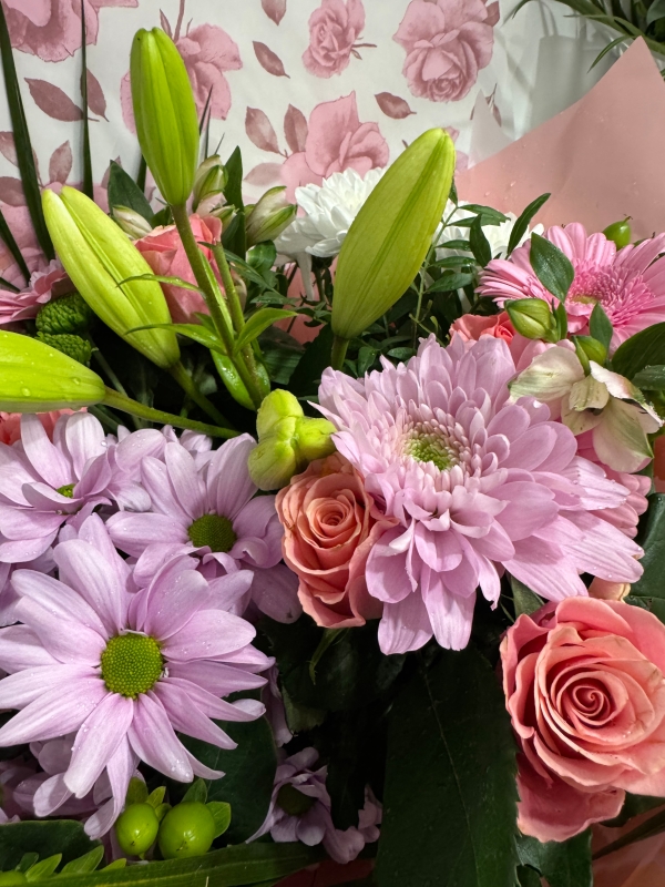 Nikos choice handtied bouquet gift wrapped into box with water