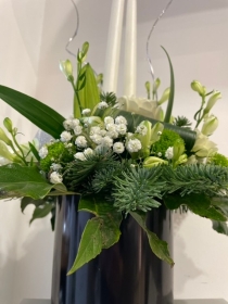 Christmas tall candles round table arrangement in black container