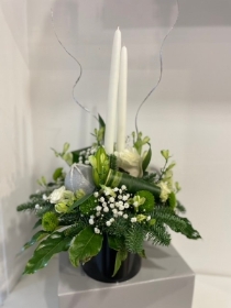 Christmas tall candles round table arrangement in black container