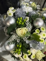 Maria’s Christmas handtied bouquet in whites and silver delivered in water and boxed