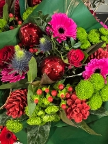 Maria’s Christmas Hot pink, Red and gold handtied bouquet in water and boxed