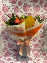 Nikos choice handtied bouquet gift wrapped into box with water